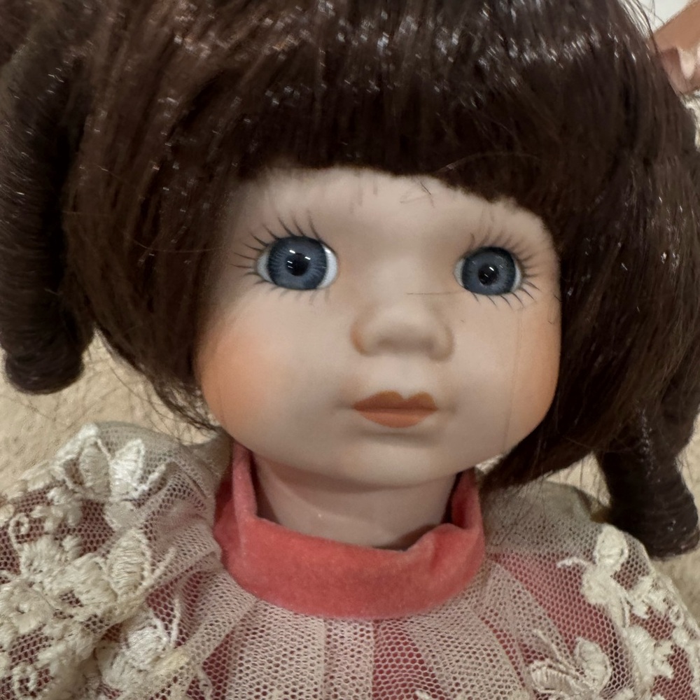 Porcelain Doll with Brown Hair and Blue Eyes